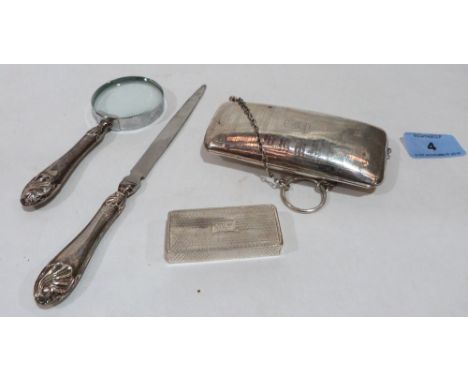 A silver engine turned purse, a magnifying glass and letter knife with silver handles and an engine turned snuffbox
