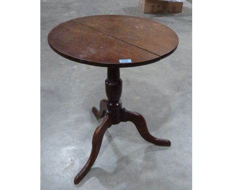 A 19th century oak tripod occasional table. 21' diam 