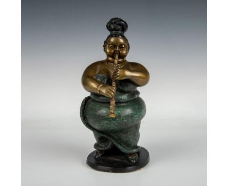 The sculpture portrays a whimsical female musician engaged in playing either an soprano saxophone or a clarinet. It is meticu