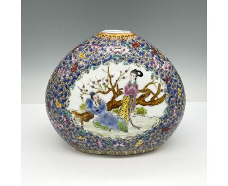 Hand painted with enamel accents, depicts man and woman in a garden setting. Crown and base are decorated with floral and scr