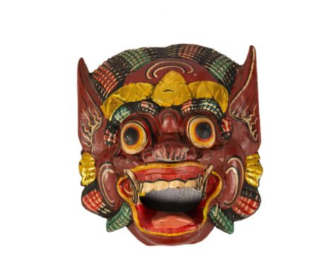 This hand-crafted mask captures Indonesia's rich cultural tapestry, craftsmanship, and spiritual significance. Adorned with g