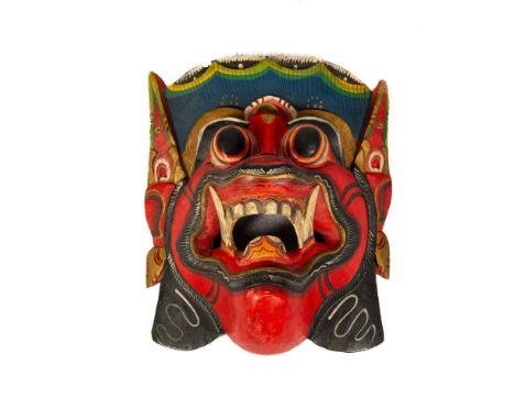 This hand-crafted mask embodies Indonesia's rich cultural tapestry, craftsmanship, and spiritual significance. It features a 
