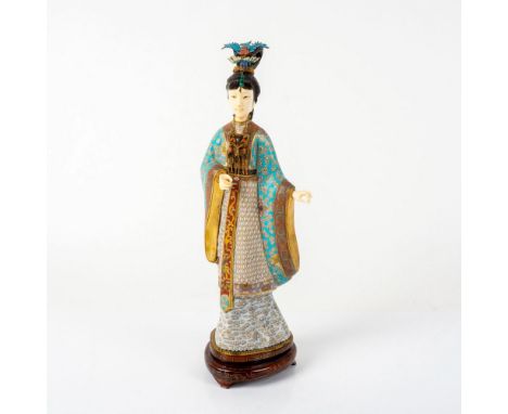 Elegant statuette woman with enamel and gold gilt blue and white detailed attire. The figure is embellished with enamel bronz