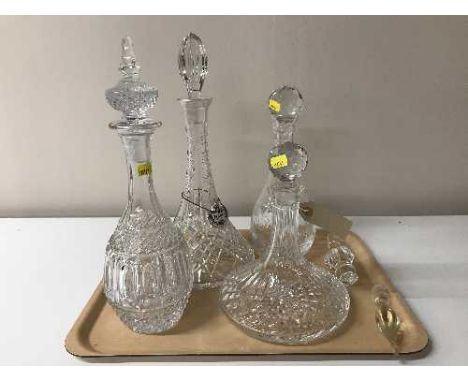 Four assorted decanters, misc. decanter stoppers, together with a  Crown Staffordshire decanter label