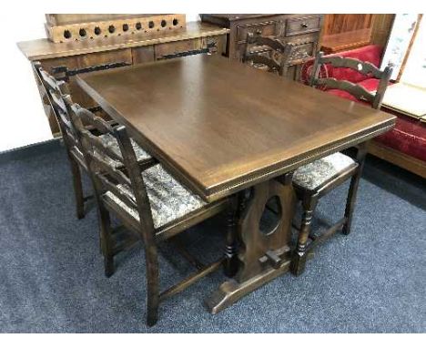 An oak refectory table and four ladder back chairs 