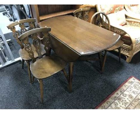 An Ercol drop leaf table and four chairs 