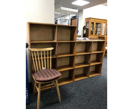 A large set of teak open shelves and an Ercol dining chair 