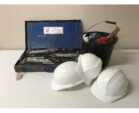 A cased Heyco tool kit, bench grinder, hard hats, hand tools, oil can, trolley jack etc 
