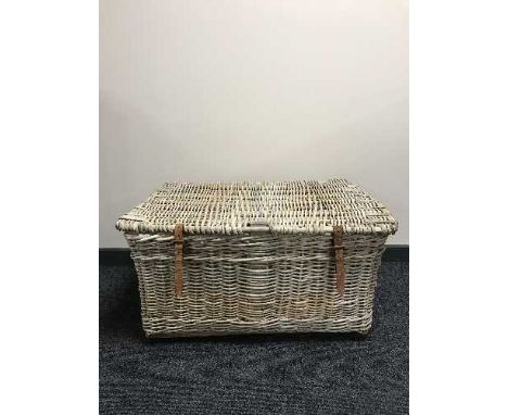 A large wicker laundry hamper 