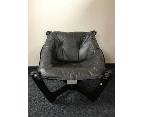 A contemporary button leather sling chair 