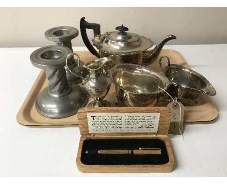 A three piece EPNS tea service and a boxed Theakstons pen, large pewter candle holders etc 