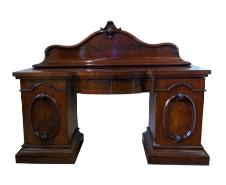 Victorian figured mahogany twin pedestal sideboard, the shaped back above inverted breakfront top, bow-front central drawer f