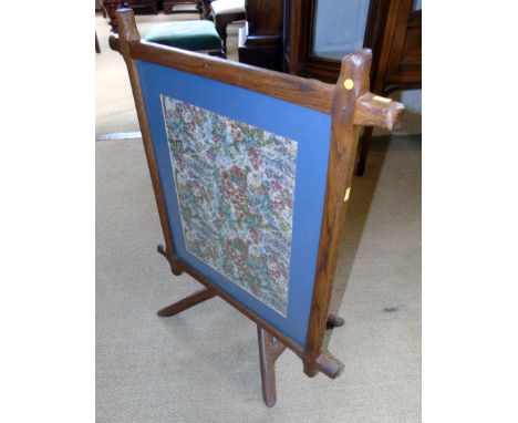 An Arts and Crafts style folding table/firescreen on rustic branch effect base Condition reports are not available for our In