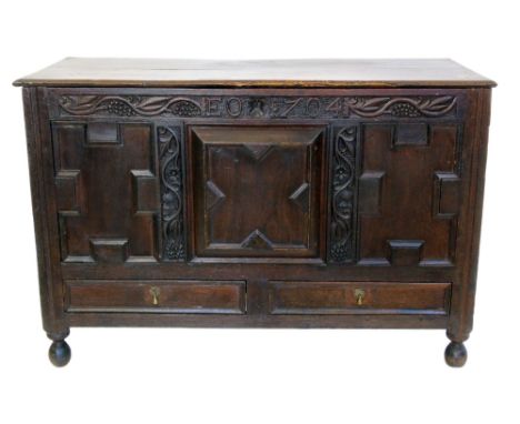 18th century oak coffer with carved panel reading E.O. 1704 Condition reports are not available for our Interiors sales.