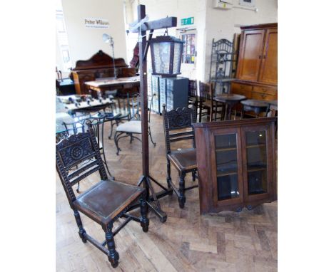 Pair of oak Jacobean style chairs, oak two door glazed wall cabinet and lamp stand. Condition reports are not available for o