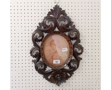 A 19th century oval portrait print, in a carved wood frame, highlighted in gilt, 46 x 30 cm