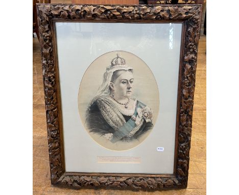 A print of Queen Victoria, in a carved wooden frame decorated holly leaves and berries, frame 80 cm x 60 cm