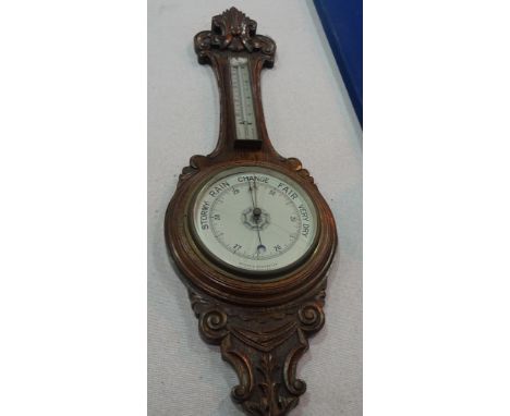 A Victorian oak barometer