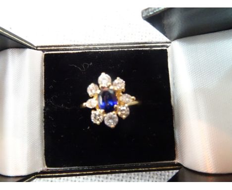 An 18ct gold sapphire and diamond ring marked 'Boucheron'