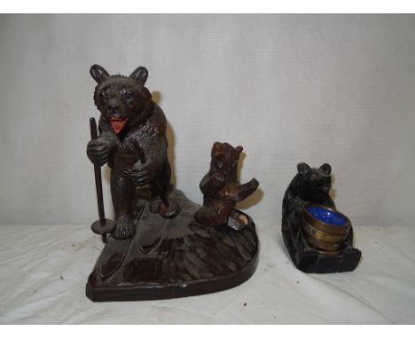 A Black Forest bear inkwell; together with two figures of bears