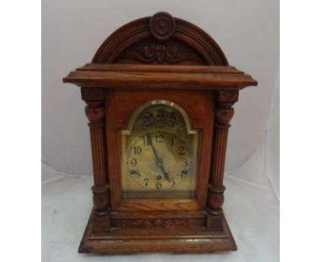 A 19th century oak bracket clock
