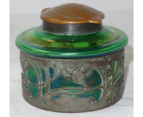An Art Nouveau Loetz-style green glass inkwell, the mount pierced with scrolling foliage