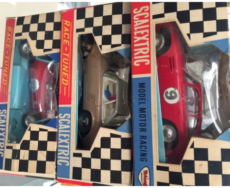 A boxed Scaletrix C68 Aston Martin; together with a boxed Scaletrix Mercedes and a boxed Offenhauser rear engine