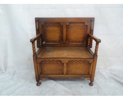 A 20th century oak monk's bench