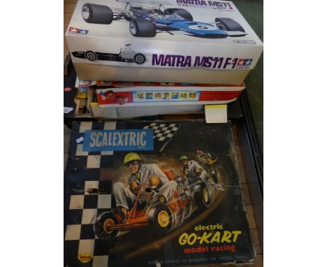 A collection of various Scalextric together with Tamiya car building set and Disneyland projector