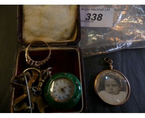 A white metal and green enamel ladies pocket watch, together with, two 9k gold gem-set rings, a 9k gold photograph locket, we
