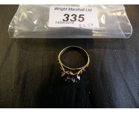 A ruby and diamond cluster ring, to a precious yellow metal shank, weight approx. 4.2g