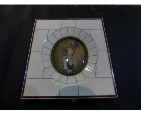 A small 20th Century miniature portrait of lady in period costume set in a piano key frame 