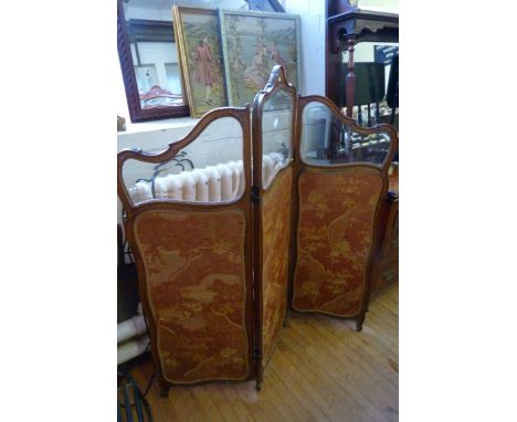 A good quality three panel mahogany framed screen decorated with floral material and bevelled glazed panels.