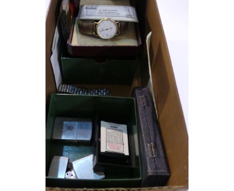 A mixed lot comprising an Eterna gents wristwatch, a Zenith wristwatch on expandable strap, various cigarette lighters and ot
