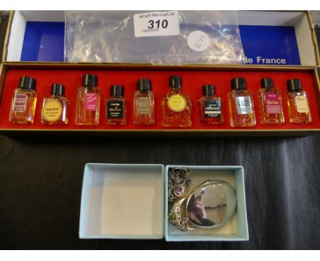 A collection of miniature perfumes 'Les Grands Parfums de France', together with a silver locket and chain, a 9k gold gem-set