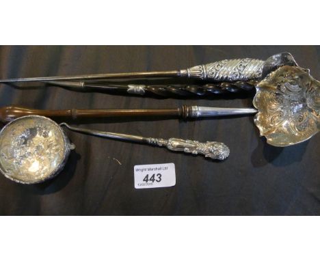 A mid-19th century silver toddy ladle, with a scroll and foliate embossed bowl and a turned wooden handle, by TS, London, dat
