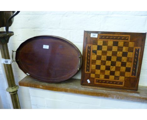 A wooden chess board, constructed of various timbers and an Edwardian oval inlaid mahogany twin handled galleried tray. CONDI