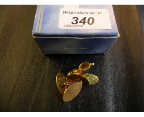 A pair of 9k gold cufflinks, together with a boot charm, weight of weighable gold approx. 5.5g (2)