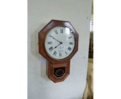 A rosewood framed octagonal faced wall clock.