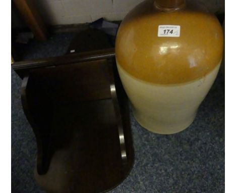 A stoneware flagon together with a wooden wall bracket (2).