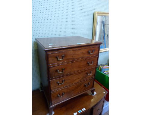 A 19th Century and later mahogany mock chest commode cabinet the front with four dummy drawers, over small bracket feet, widt