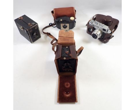 A Voigtlander Brilliant camera in leather case plus a Russian camera, Kodak Brownie and one other