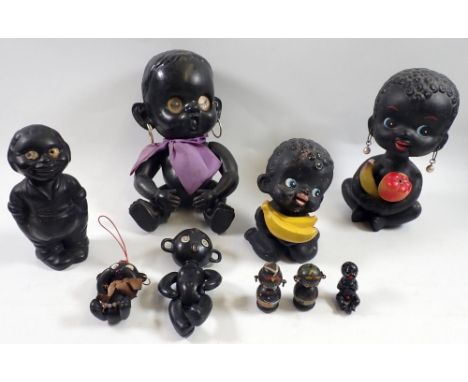 A group of black Kewpie style dolls and figures, largest 24cm