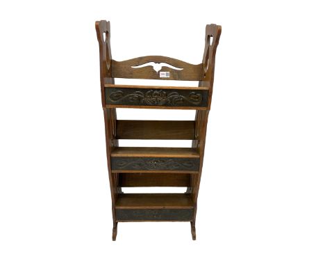 Art Nouveau oak carved book trough, pierced handles and back with moulded and hammered metal frontsDimensions: Height:&nbsp;8