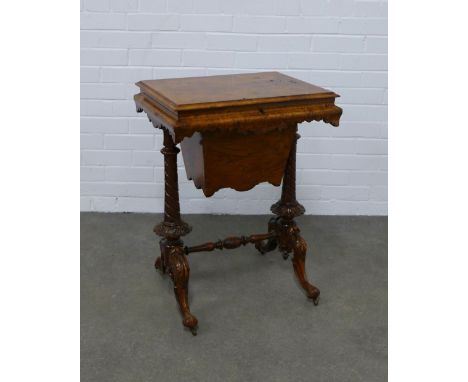 Burr walnut sewing table, hinged lid and fitted interior above pull out work bag, raised on turned supports and splayed legs,