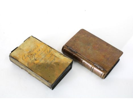 An 18th century brass box in the form of a book, the cover inscribed in Latin and dated 1726, 12 x 8cm together with a Chapma