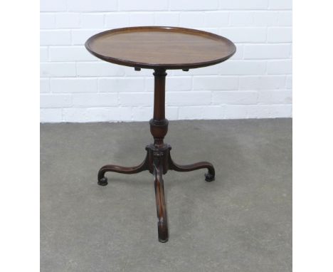 Mahogany tilt top wine table with a circular dished top, on a pedestal base with elegant tripod legs having scroll feet and p