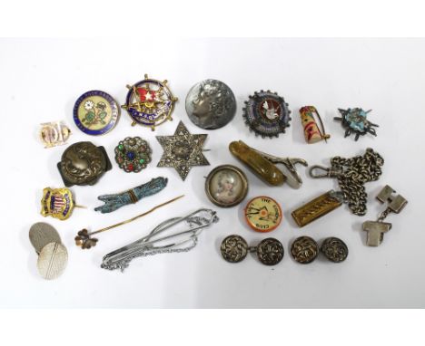 A collection of early 20th century and later badges, pins, cufflinks to include a pair of silver celtic knot pattern cufflink