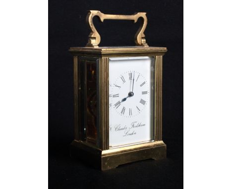 A Charles Frodsham brass cased carriage clock with presentation inscription dated 1983, 6" high