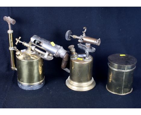 Five brass blow lamps, various, an assortment of horse brasses, a set of brass letter scales and other assorted brass ware